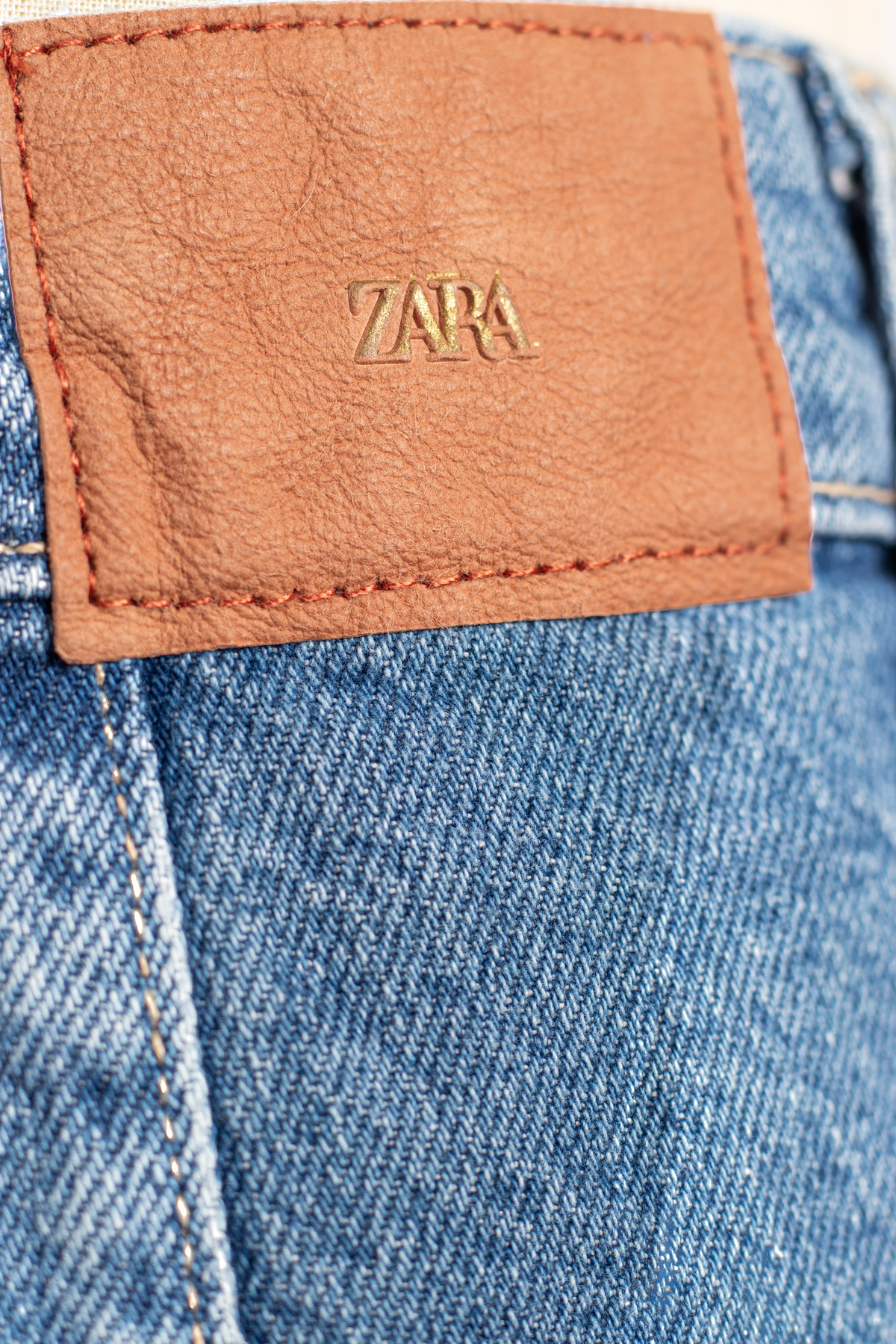 FALDA SHORT DE MEZCLILLA ASIMÉTRICA